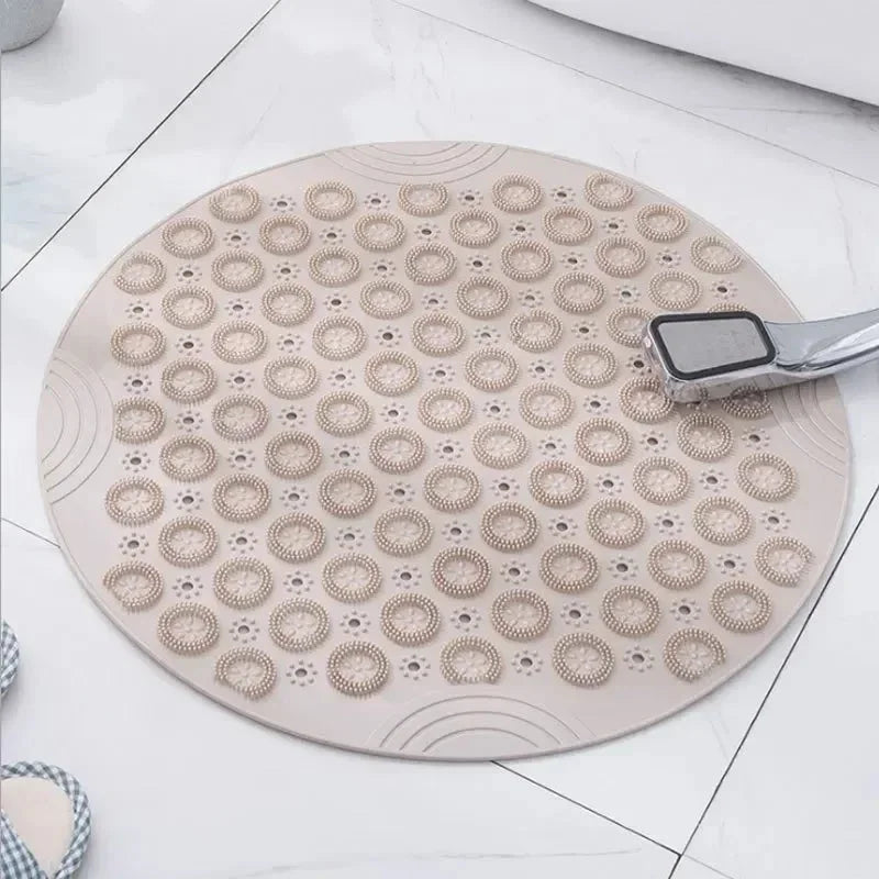 Tapis rond beige de bain en PVC antidérapant avec ventouses et picots de massage, vue de dessus