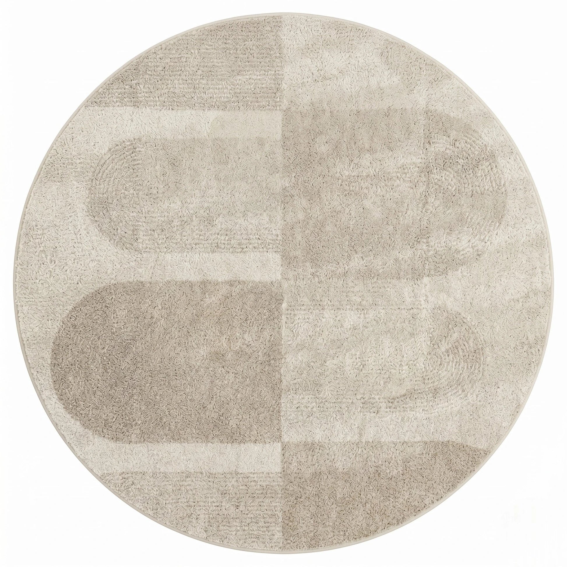 Vue de dessus du tapis rond beige blocs géométriques montrant le motif en pavés assemblés crème