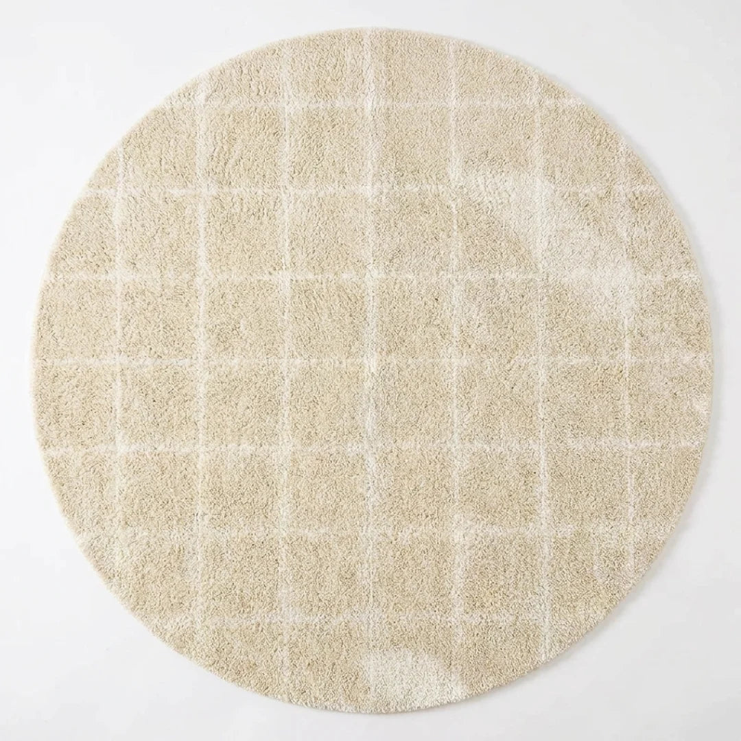 Tapis rond beige grille géométrique, vue de dessus sur fond blanc