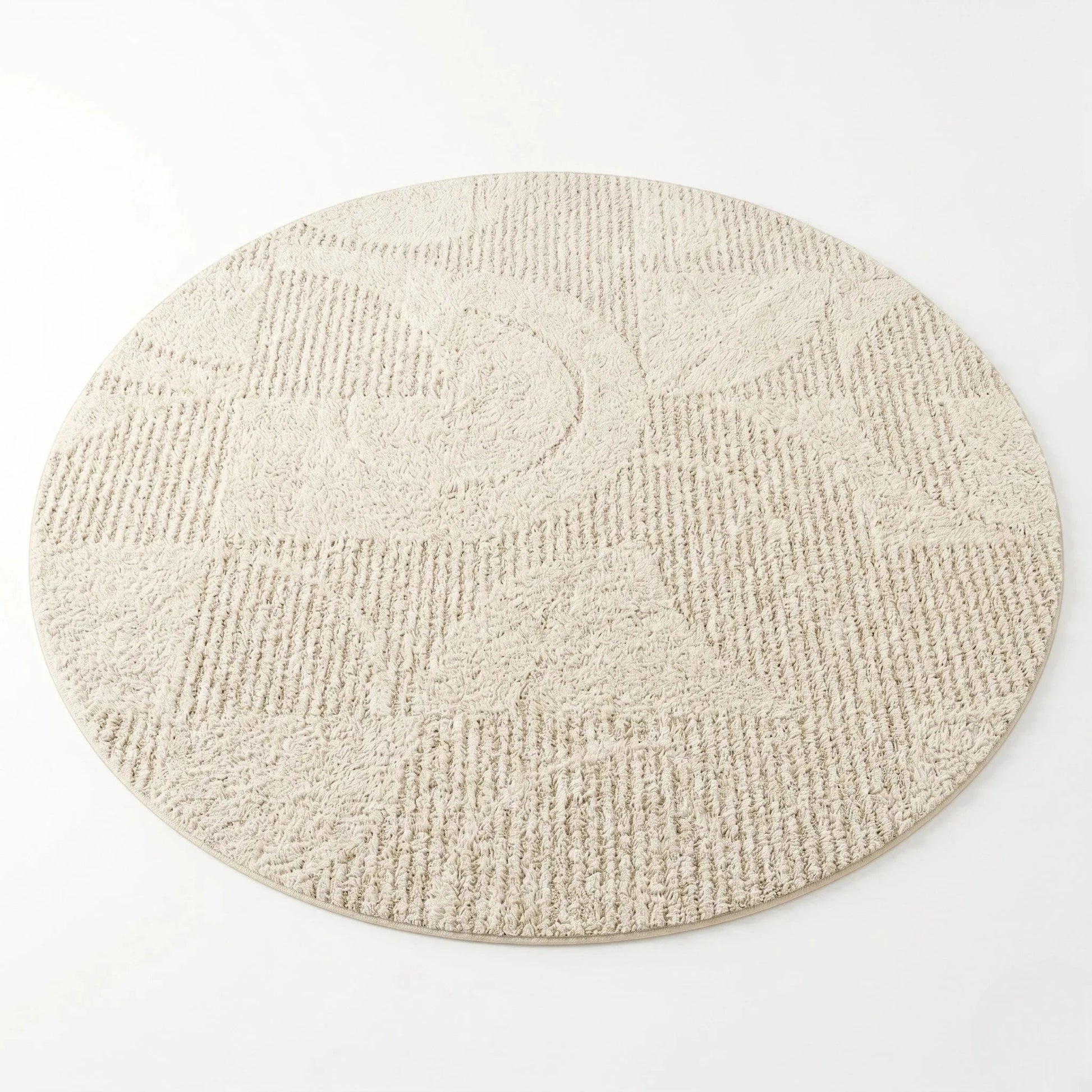 Tapis rond beige motif vagues vu de dessus pour mise en avant du relief des fibres