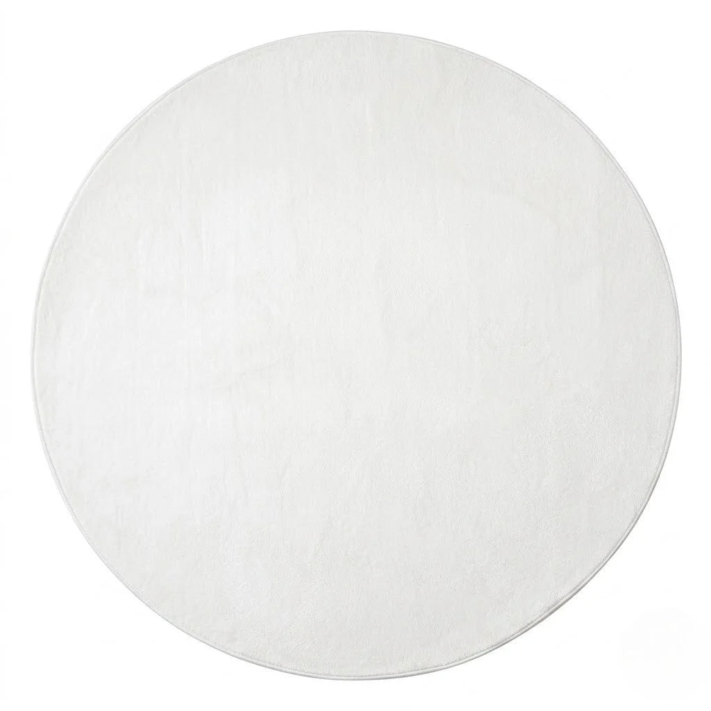 Vue studio du tapis rond blanc uni en peluche microfibre douce