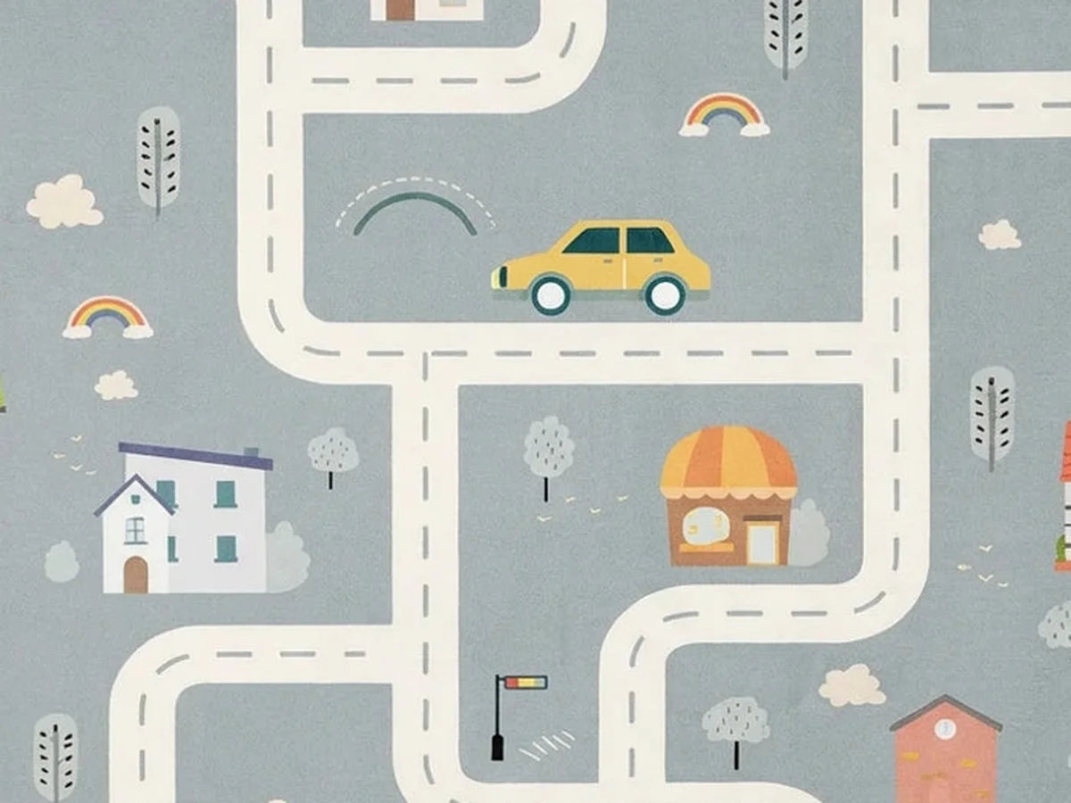 Vue rapprochée du motif et de la texture du tapis rond enfant route village gris