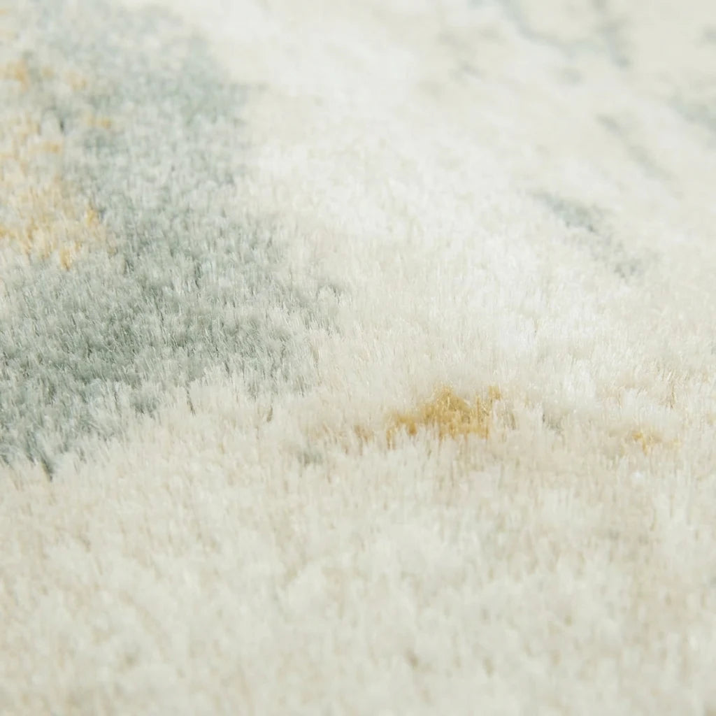 Velours imitation cachemire du tapis rond écru céladon vu de près