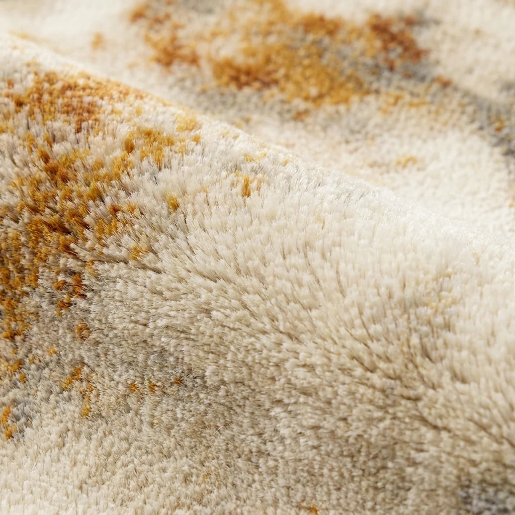 Velours imitation cachemire du tapis rond écru doré vu de près