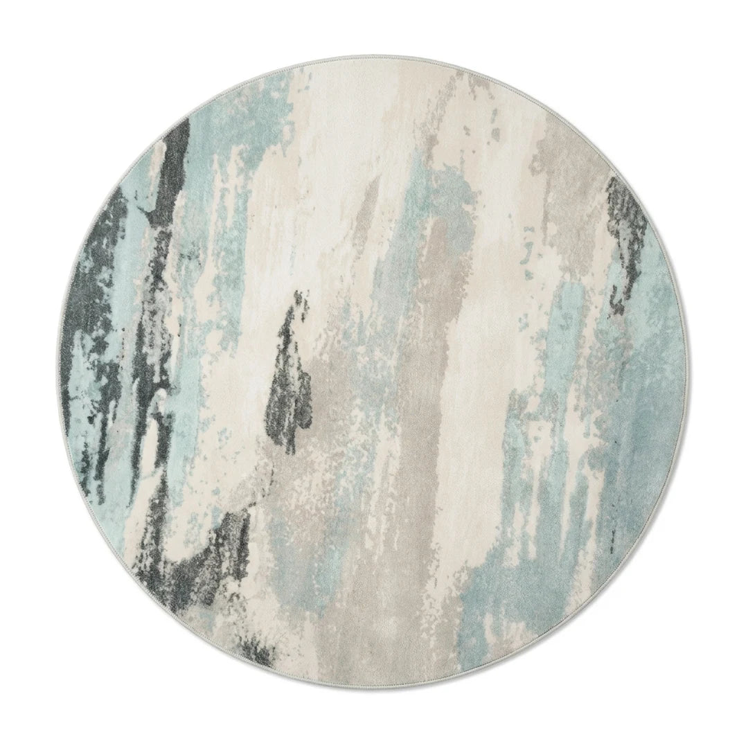 Tapis rond grège bleuté vu de dessus sur fond blanc