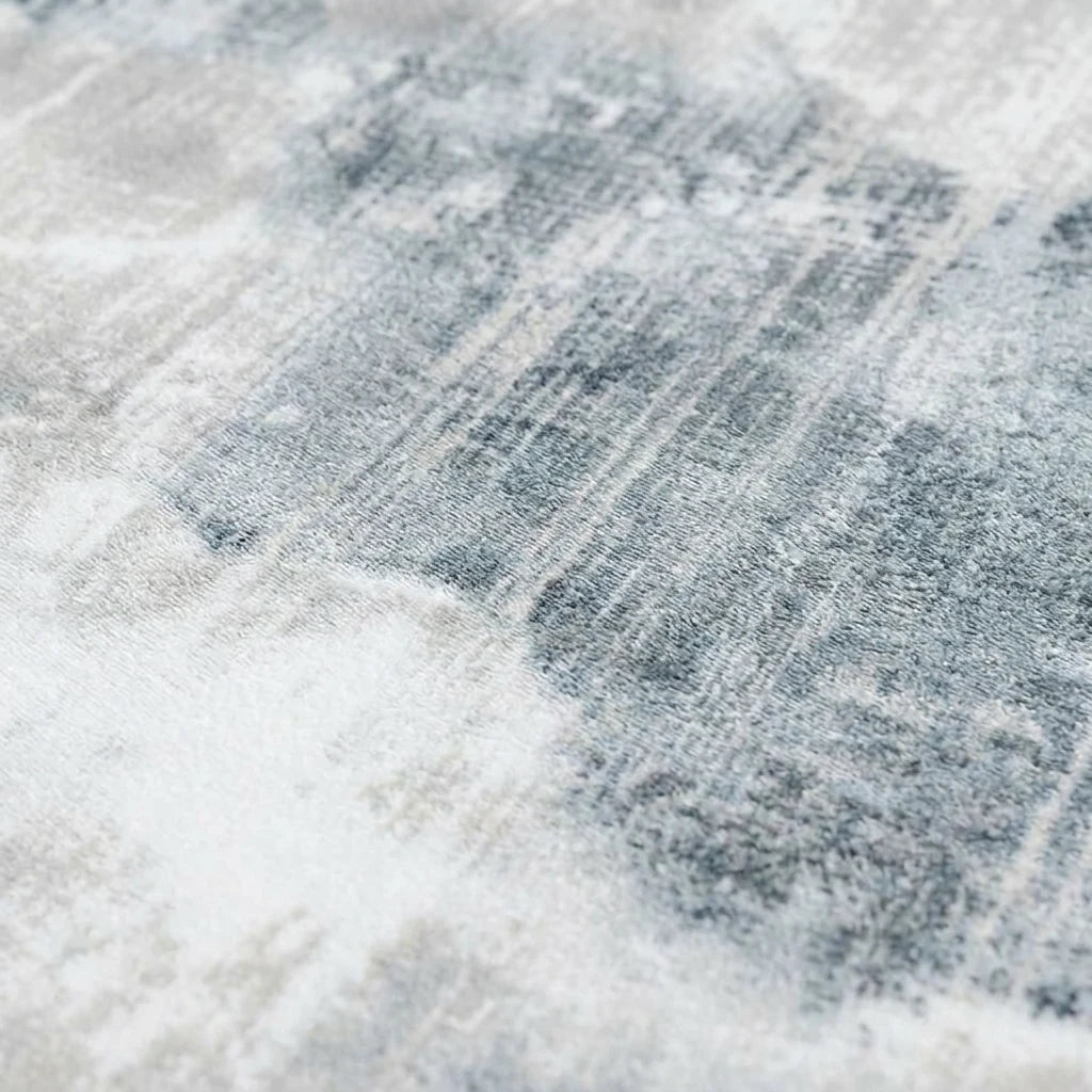 Velours imitation cachemire du tapis rond gris bleuté vu de près