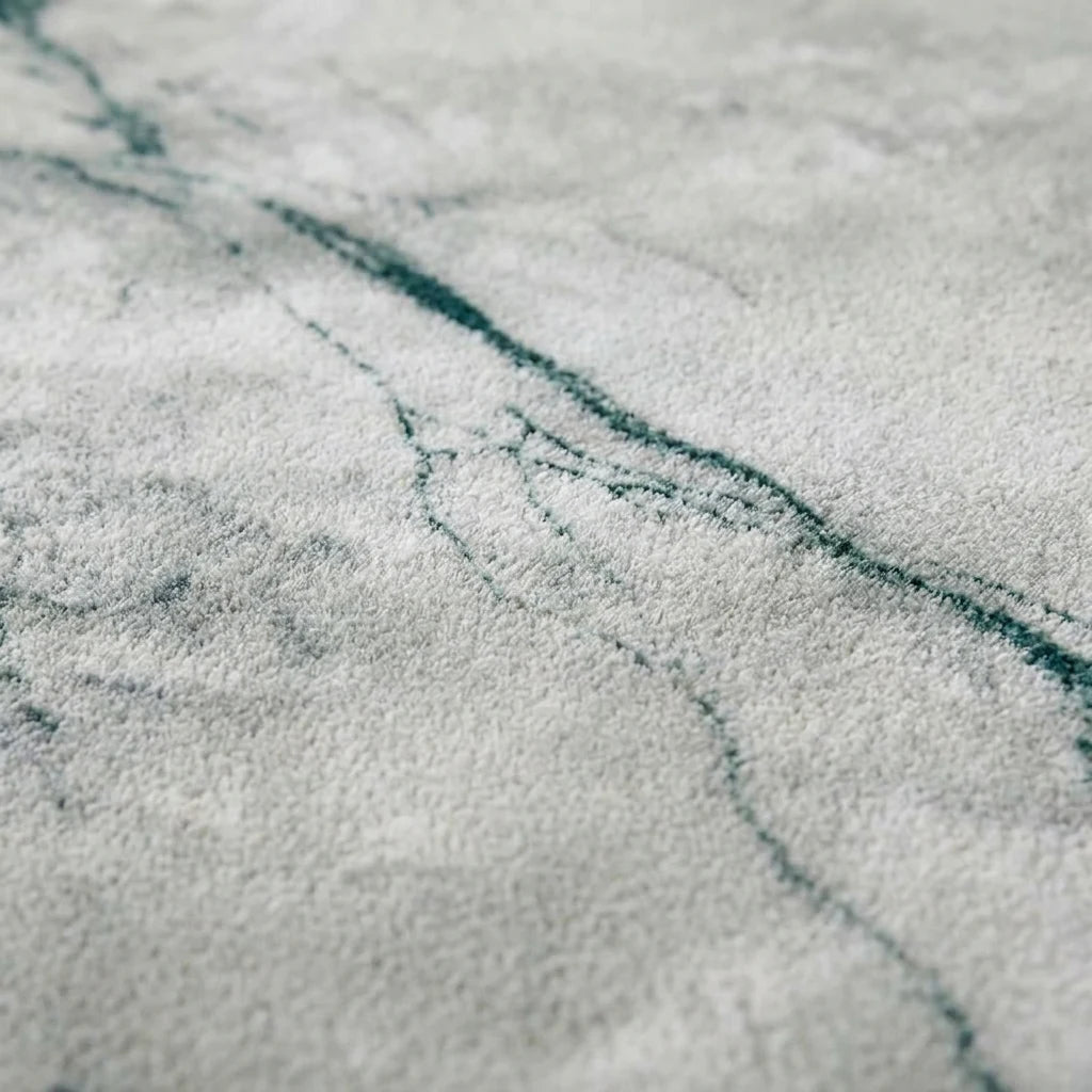 Velours imitation cachemire du tapis rond marbre gris vu de près
