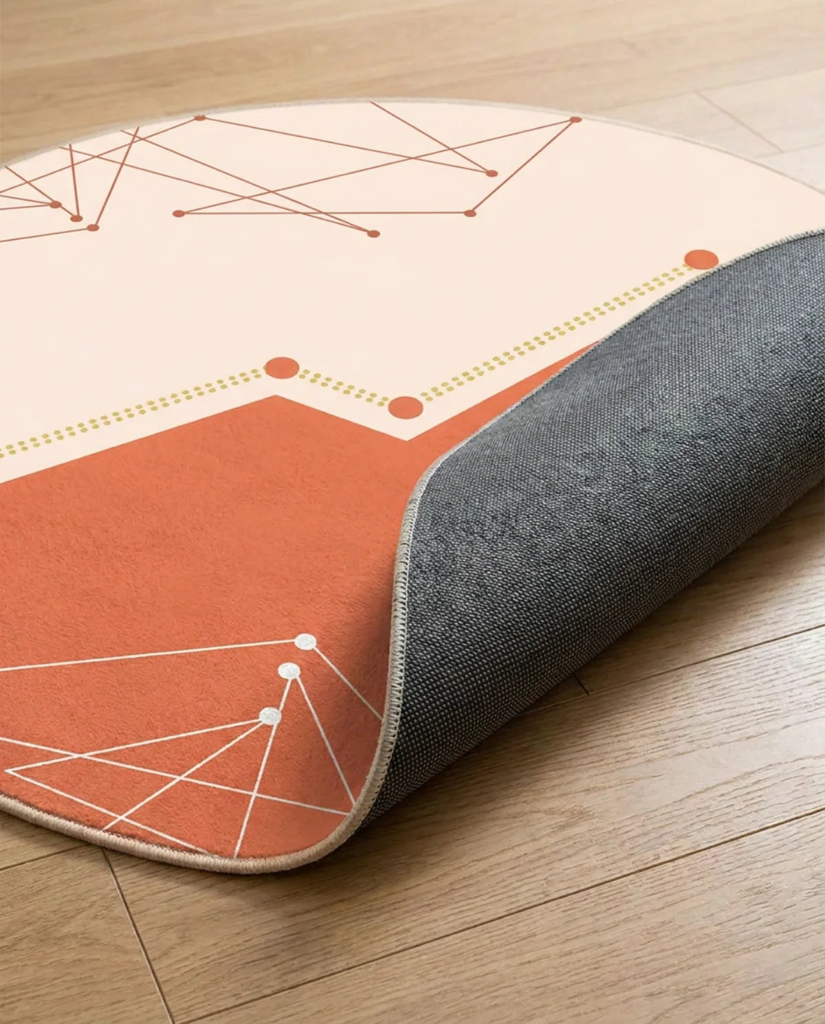 Profil fin et sous-face antidérapante du tapis rond lavable corail graphique