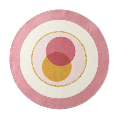 Tapis rond lavable en machine rose cercles dorés