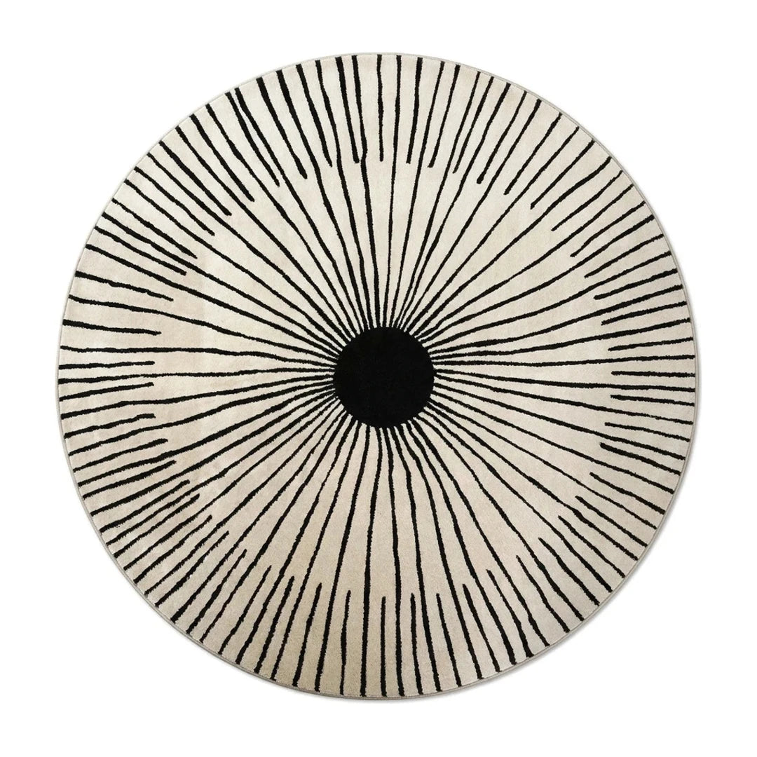 Tapis rond noir et blanc rayons soleil, vue de dessus sur fond blanc