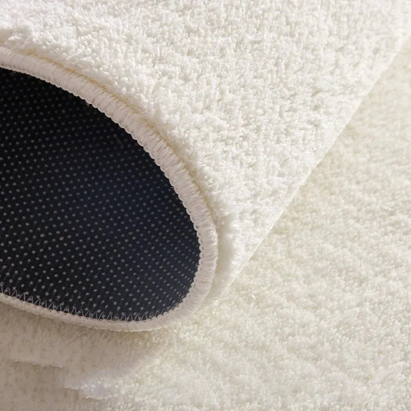 Rendu naturel du tapis rond rose poudré peluche douce en lumière du jour