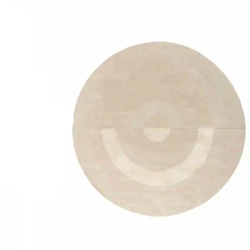 Photo originale du tapis rond salon cercles concentriques beige crème, vue top-down studio