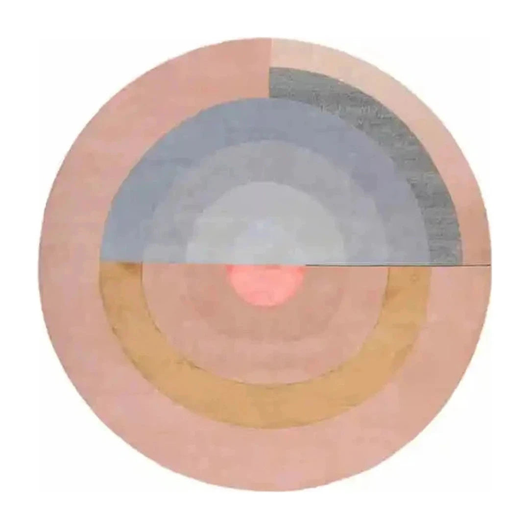 Tapis rond salon cercles concentriques rose poudré, vue de dessus sur fond blanc